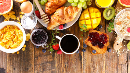 Fototapeta na wymiar continental breakfast- coffee cup, croissant, cereal and fruit