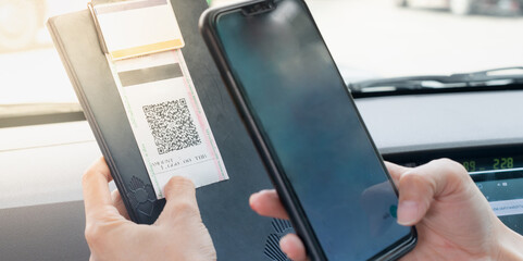 Female hand scanning the QR code with mobile phone for order foods and pay at the restaurant for the new technology e-wallet and e-payment.