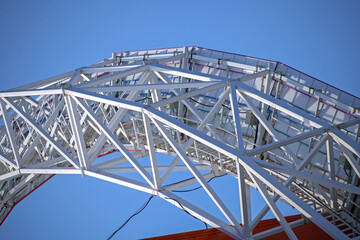 A fragment of a metal structure against a blue sky