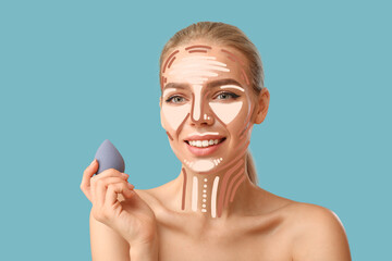 Beautiful young woman applying contouring makeup against color background