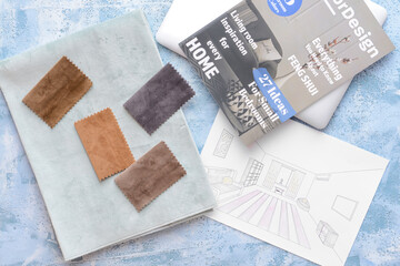 House plan, magazine and fabric samples on color background