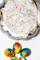 Beautiful bright colorful multi-colored cupcake and Easter eggs.