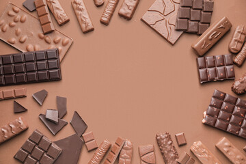 Frame made of different chocolate on color background