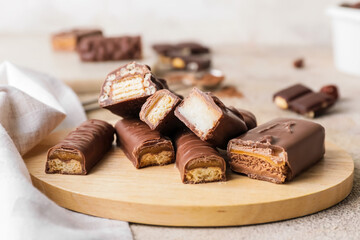 Sweet chocolate bars on table