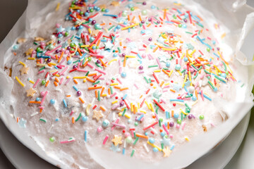 Easter cake, kulich with glaze on white background.