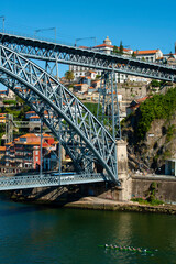 Dom Luis I Bridge over Duoro river and view over old town in Porto, Portugal