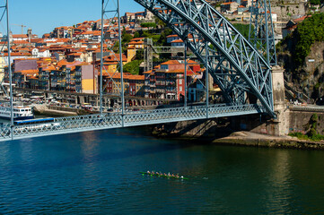 Dom Luis I Bridge over Duoro river and view over old town in Porto, Portugal