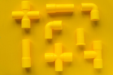 Kids toy yellow pipe on yellow background