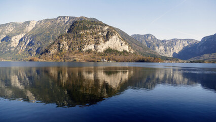 Lake Hallstatt in Austria with reflections of the mountains- Alpine view.