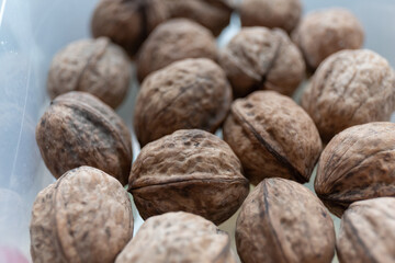 Close up of walnuts on a kitchen table in a container