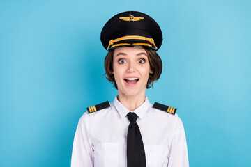 Photo of charming amazed shocked young woman excited travel trip plane isolated on blue color background