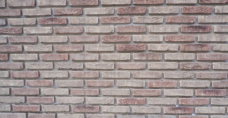 The wall is made of ceramic clinker bricks. Natural urban background. Space for creativity and text. Seamless background- abstract nature pattern.