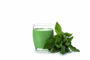 Glass of green smoothie and spinach isolated on white background