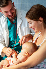 Obraz na płótnie Canvas Pediatric doctor exams little baby. Health care, medical examination, people concept