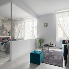 Glazed bedroom in elegant studio apartment