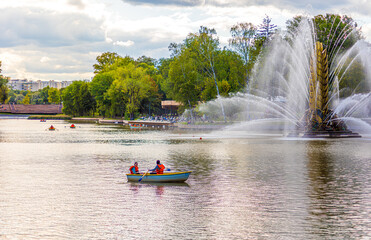 Fototapeta premium vacationers on boats, the third Kamensky pond at VDNH in Moscow.