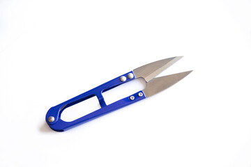 Blue scissors to cut the thread isolated on white background