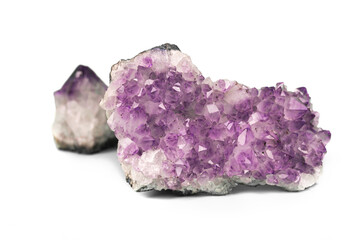 Two raw natural purple amethysts cluster crystals isolated on white background. Big sparkle druse...