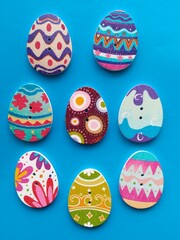 wooden buttons in the shape of an egg on a blue background