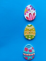 wooden buttons in the shape of an egg on a blue background