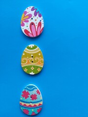 wooden buttons in the shape of an egg on a blue background