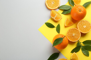 Delicious oranges on color background, flat lay. Space for text