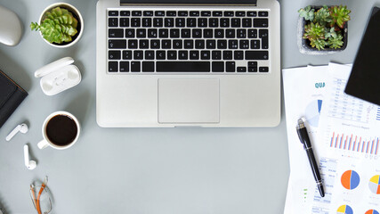 Laptop and modern gadgets on a grey office desk top view