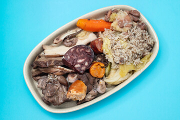 typical portuguese dish meat, smoked sausages and vegetables on the dish
