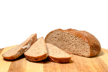 Sliced rye bread on a cutting board. Healthy baked bread. Flat lay. Food concept.Top view
