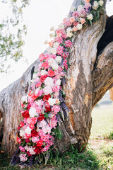 close-up of a tree trunk decorated with flowers