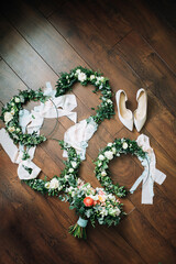 bridesmaids wreaths and wedding shoes with bouquet