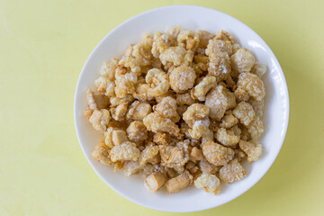 Pork crackling (pork snack, pork scratching) is fried pork skin as snack and we can eat it with noodles in Thai food style.