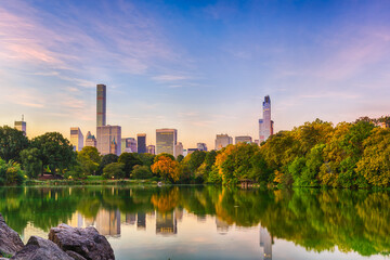 Cityscape of Central Park south from the lagoon in Central Park, New York, New York, USA.