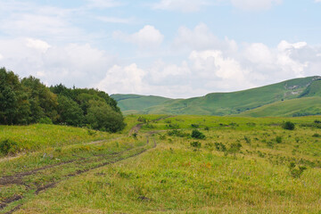 Beautiful landscape with meadows and forests in foothills of North Caucasus.
