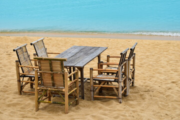 Bamboo table and chairs on Thai sand beach