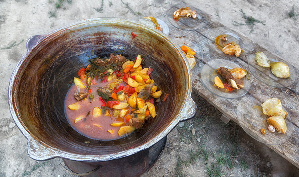 Dymlyama is an Uzbek national dish. Cooking dymlyama in a cauldron