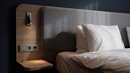 Close-up fragment of bedroom with empty bedside table, reading lamp and a USB socket in modern...