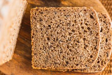 Close up brown bread in a wood brown background