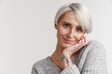 Young grey-haired woman smiling and looking at camera