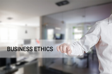 Male hand pressing the word business ethics on a virtual search bar.