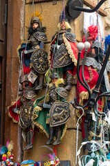 Hanging Sicilian marionettes displayed for sale