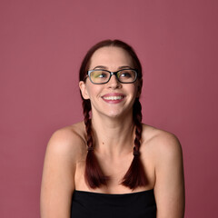 close up portrait of red haired women with different facial expressions on a pink studio background.