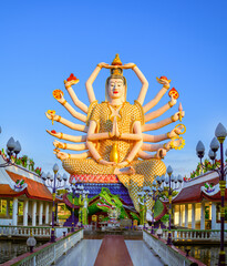 Wat Plai Laem temple the giant Guanyin  has 18 hands. statue which is a beautiful towering white structure at Koh Samui in Surat Thani, Thailand.