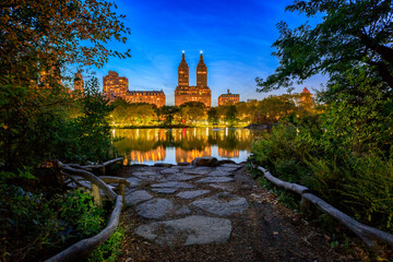 Skyline with apartment skyscrapers over lake in Central Park in midtown Manhattan in New York City
