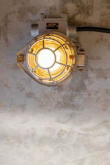 Industrial lamp on the concrete ceiling