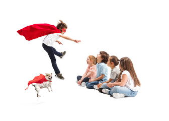 Child pretending to be a superhero with his super dog and friends sitting around