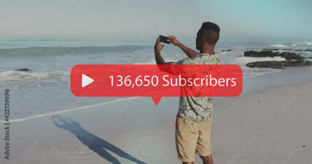 Poster Animation of speech bubble with subscribers and numbers over man filming sea with smartphone