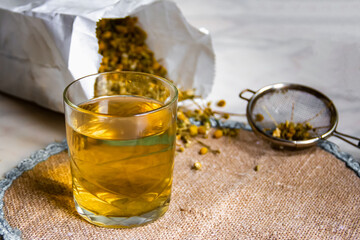 A glass of dry chamomile tea.