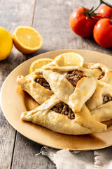 Traditional middle eastern fatayer on wooden table