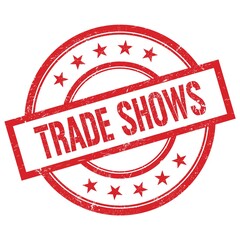 TRADE SHOWS text written on red vintage round stamp.